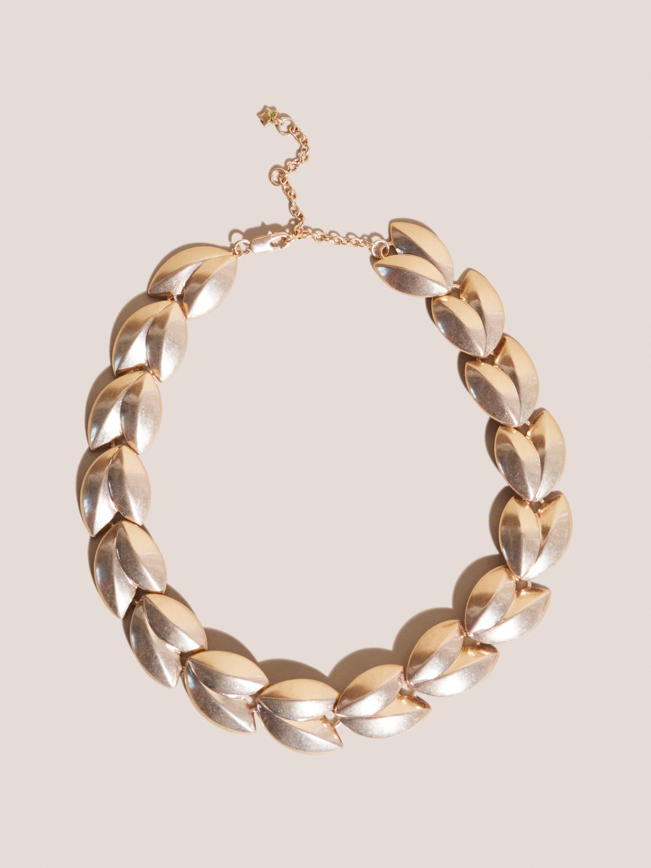 Leaf Necklace in GLD TN MET - MODEL FRONT