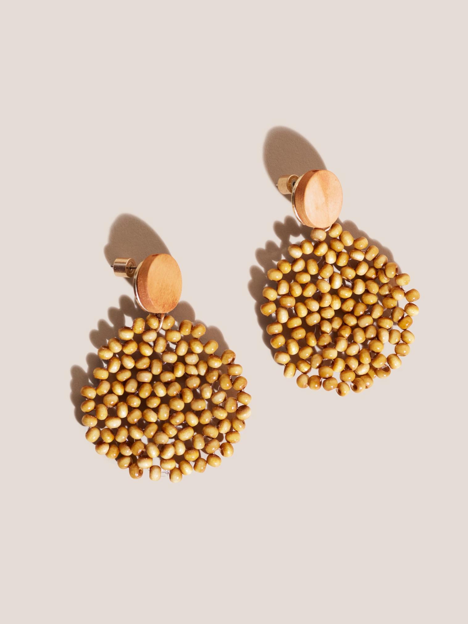 Wood Circular Drop Earrings in MID BROWN - MODEL FRONT