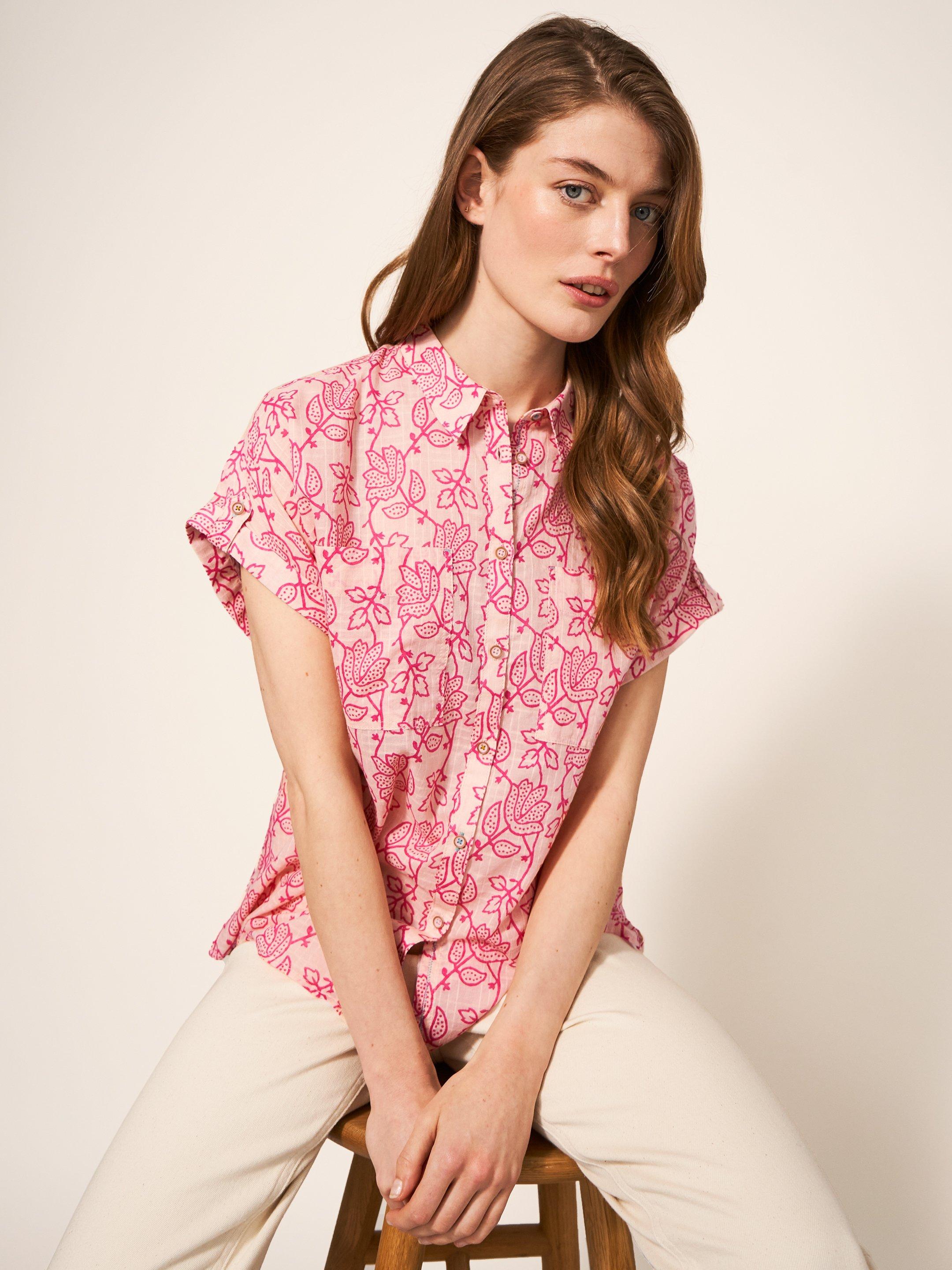 pink and white womens shirt