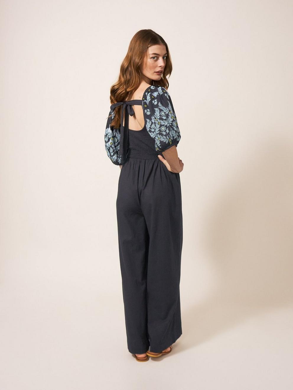 Reese Jumpsuit Embroidered in PURE BLK - MODEL BACK