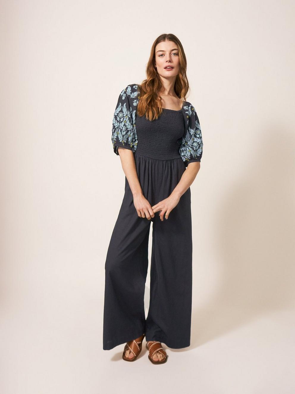 Reese Jumpsuit Embroidered in PURE BLK - MODEL FRONT