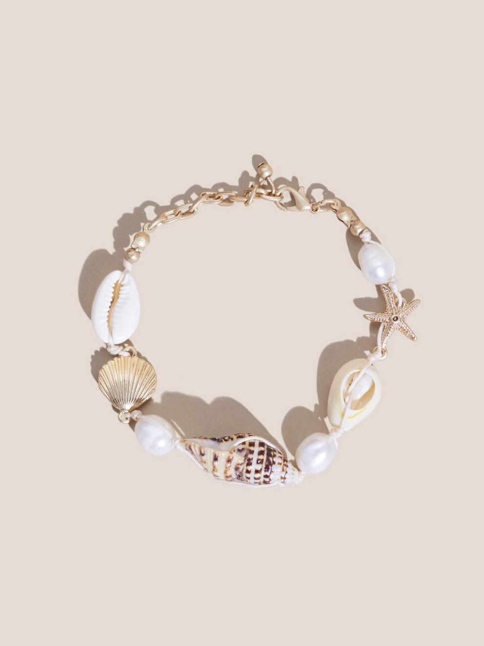 SHELL CHARM BRACELET in GLD TN MET - MODEL FRONT