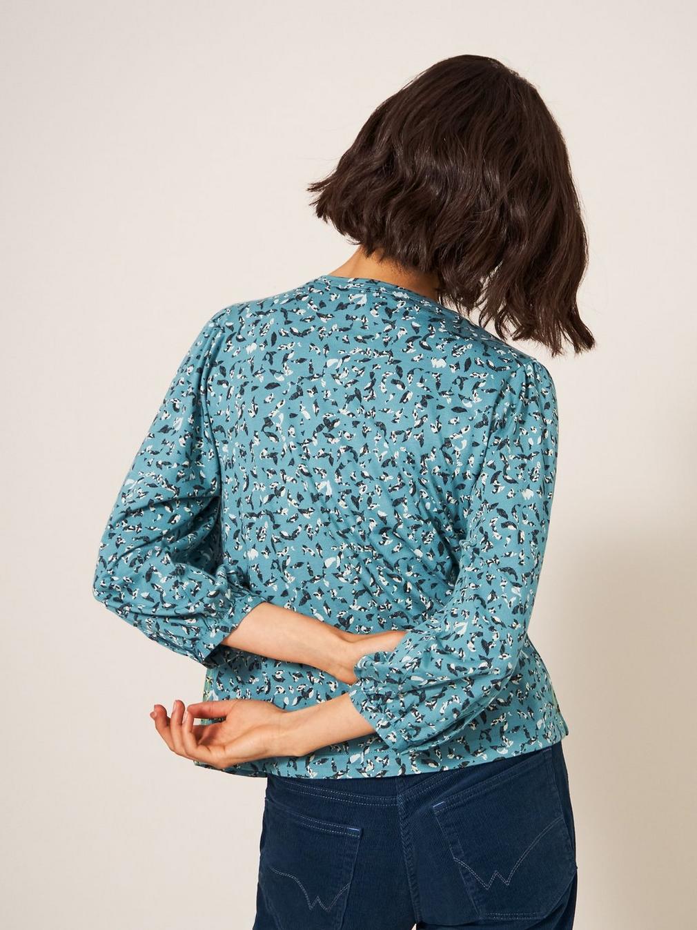 BENNIE TIE HEM SHIRT in TEAL PR - MODEL BACK