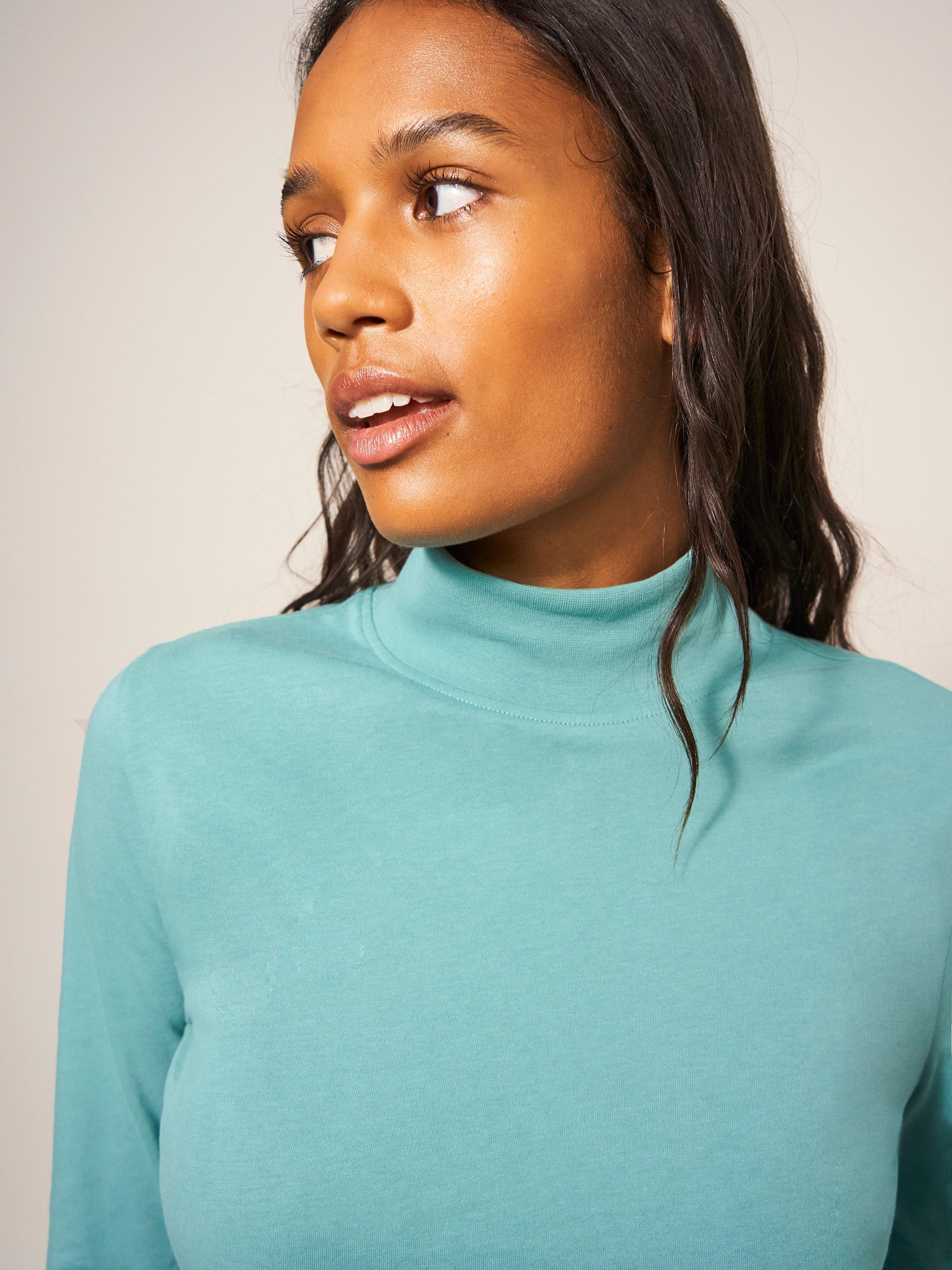 CAMILE HIGH NECK TEE in LGT TEAL - MODEL FRONT