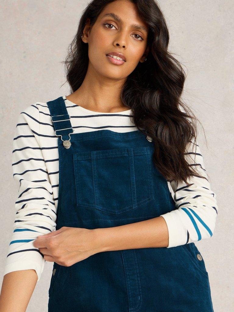 Emmie Organic Cord Pinafore in DK TEAL - MODEL DETAIL