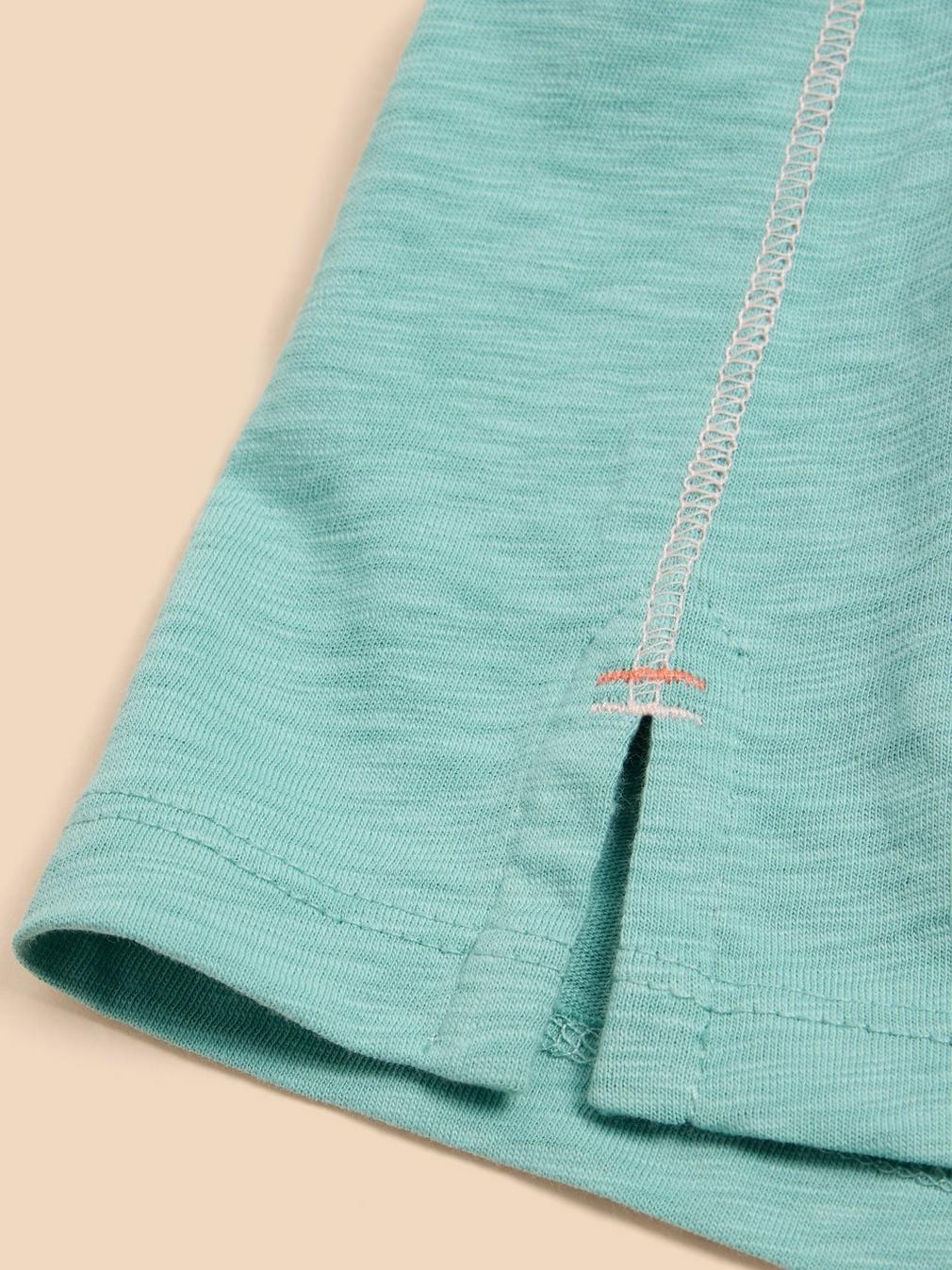 ABBIE TEE in MID TEAL - FLAT DETAIL