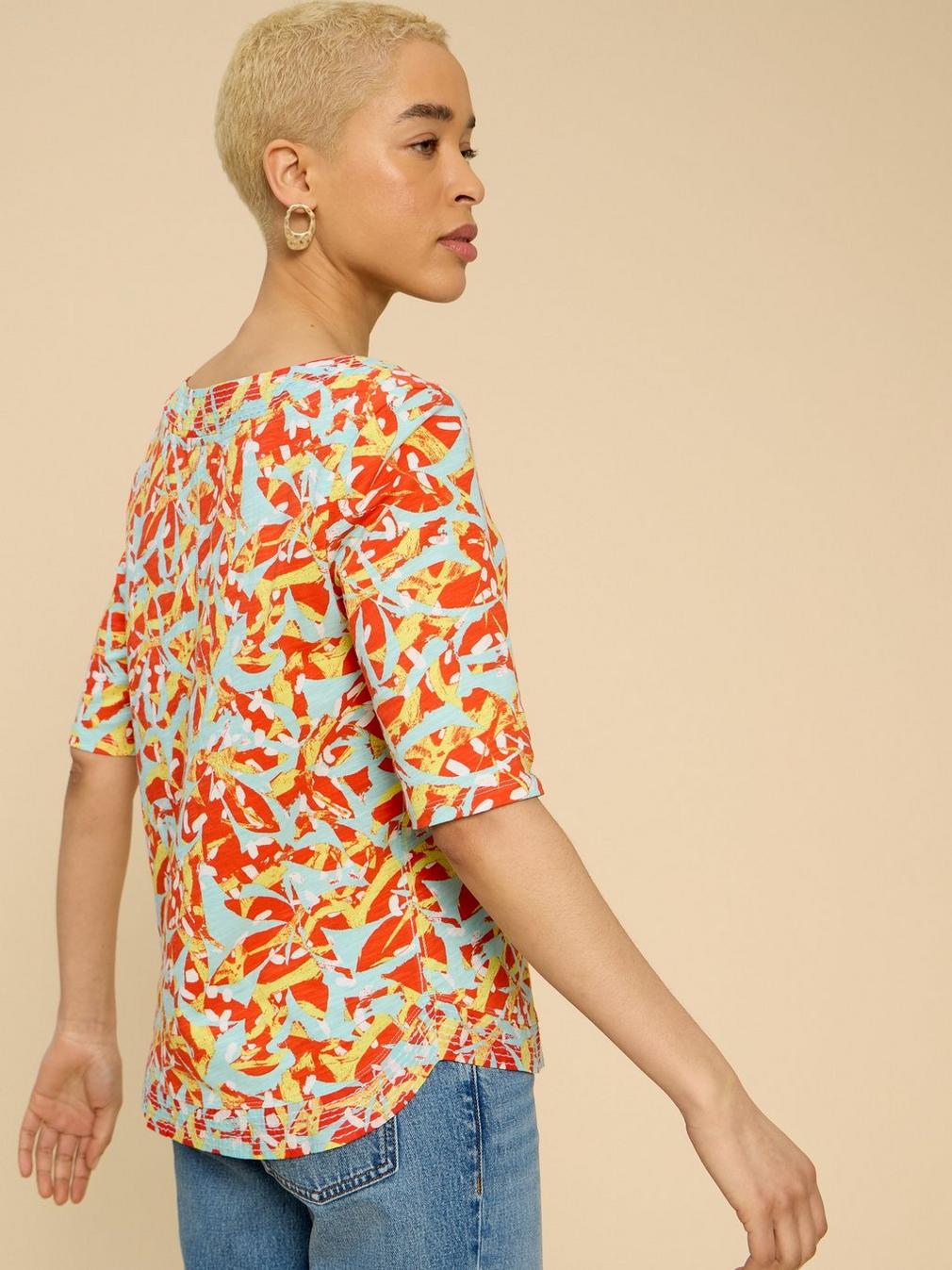 WEAVER JERSEY TOP in ORANGE PR - MODEL BACK