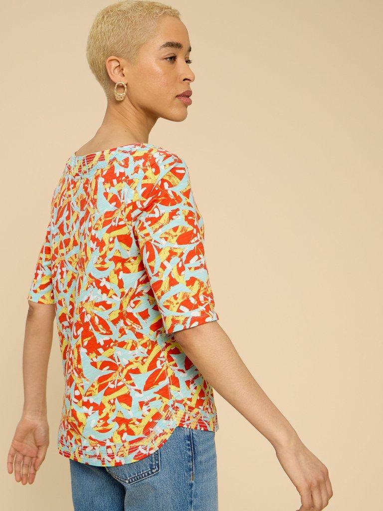 WEAVER JERSEY TOP in ORANGE PR - MODEL BACK