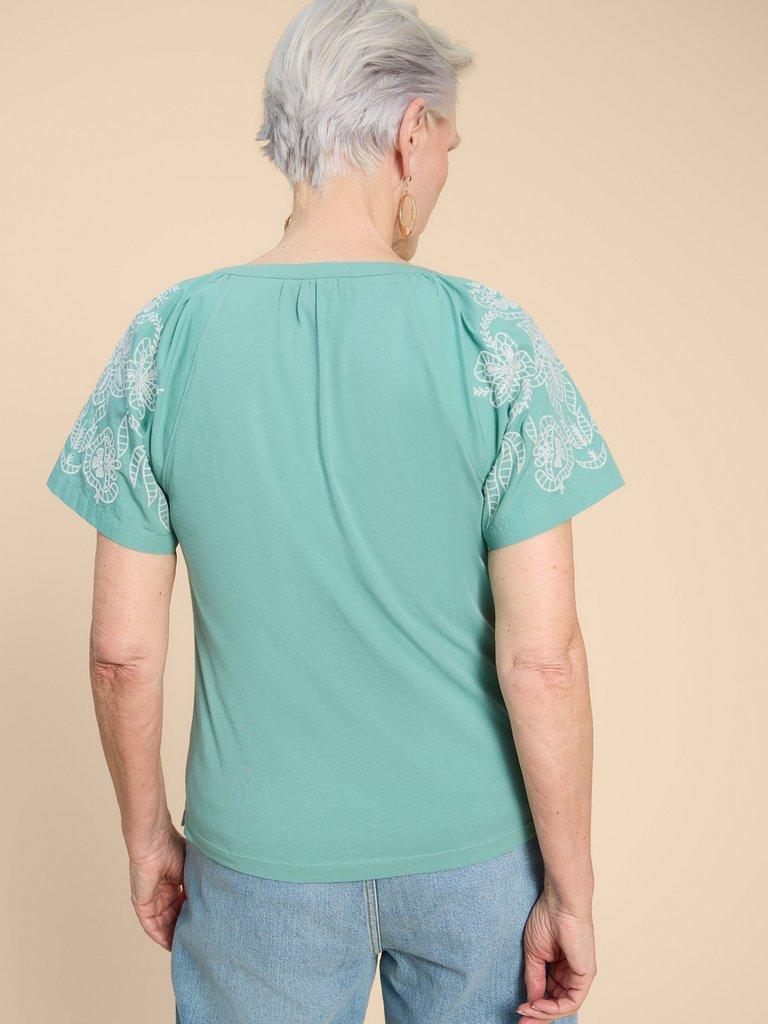 DAISY RAGLAN SHIRT in MID TEAL - MODEL BACK