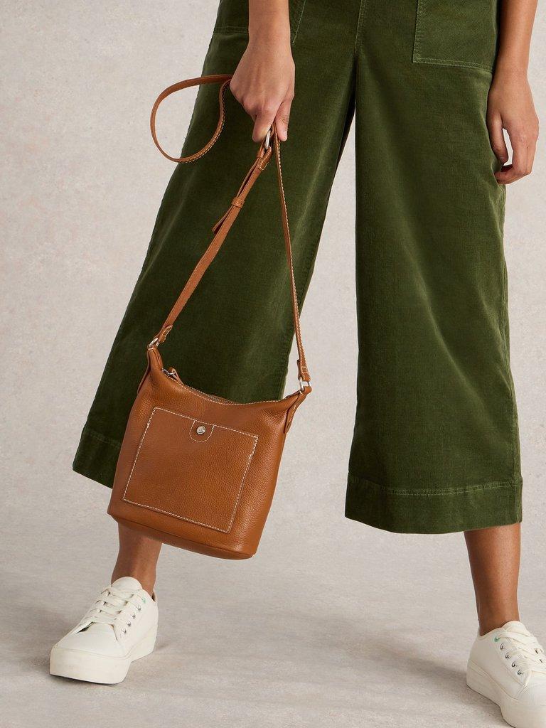 Mini Leather Fern Crossbody in MID TAN - MODEL FRONT