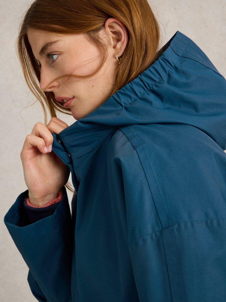 Winnie Waterproof Coat in DK TEAL - MODEL DETAIL