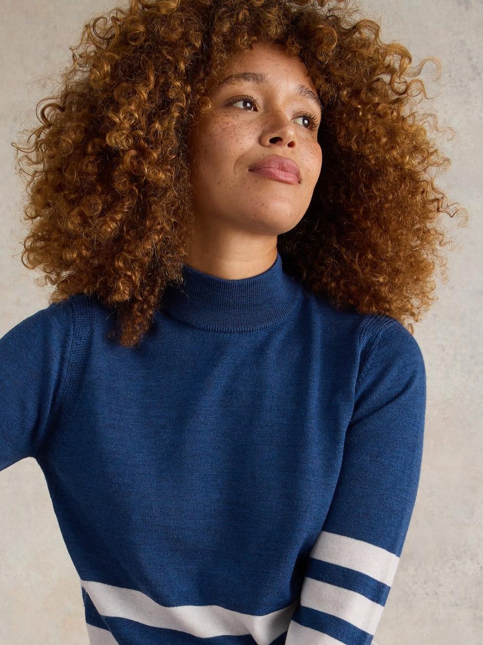 ROLL NECK MERINO JUMPER in BLUE MLT - MODEL DETAIL