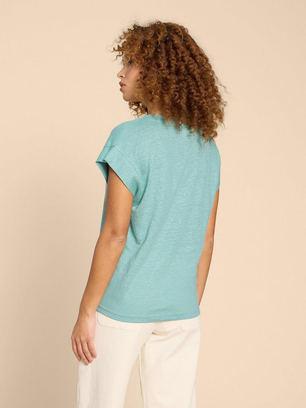 IVY V NECK LINEN TEE in MID TEAL - MODEL BACK