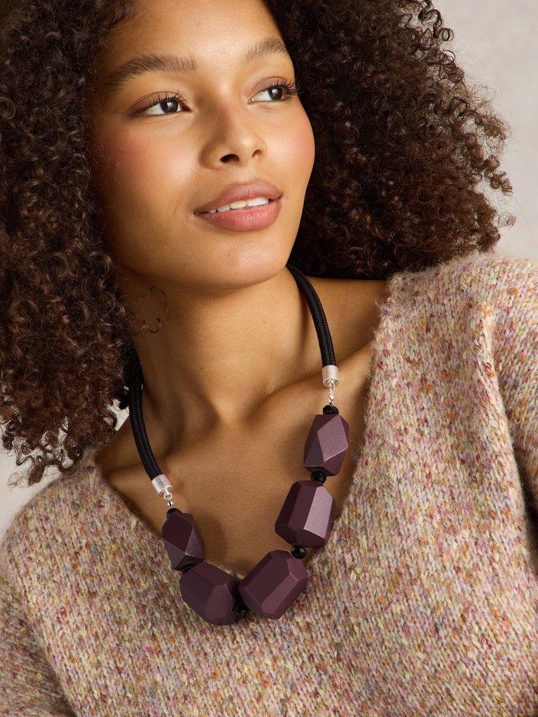 CARNATION BEADED NECKLACE in DK PLUM - MODEL FRONT