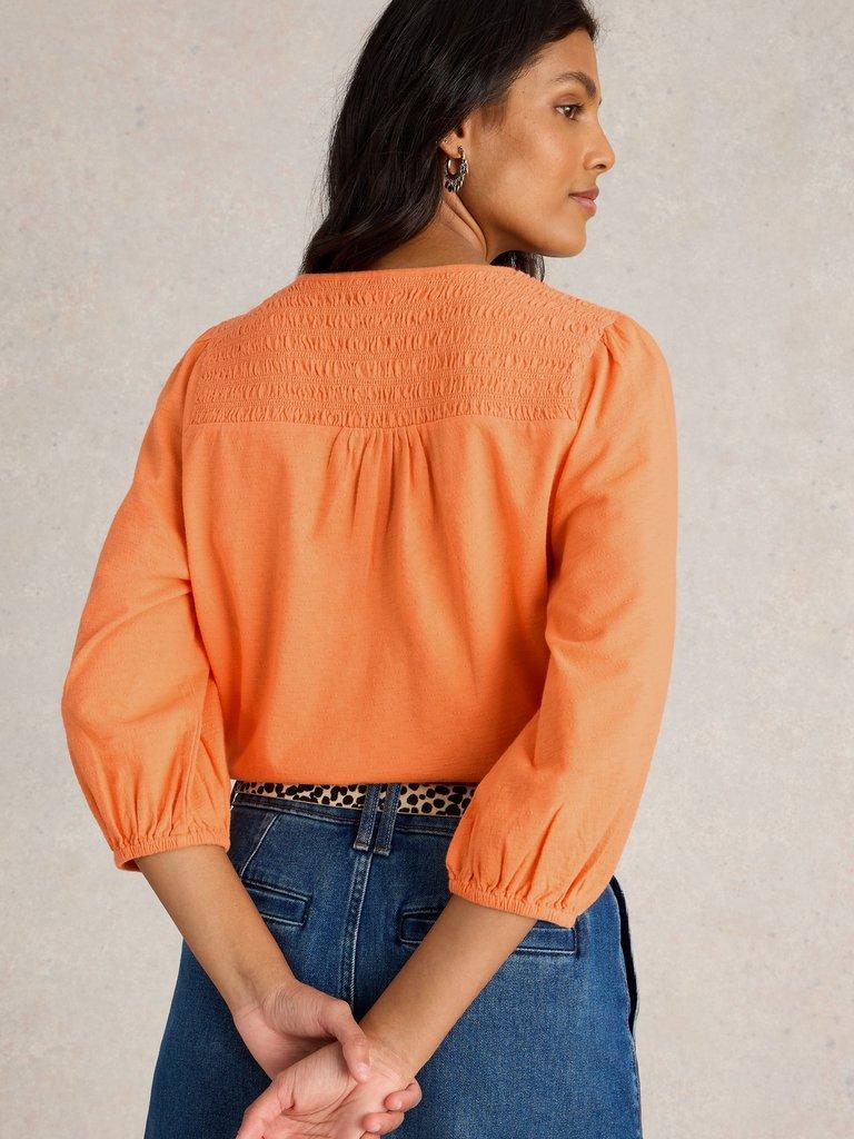 DANIELLA SHIRRED TOP in MID ORANGE - MODEL BACK