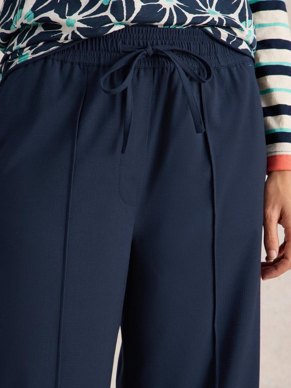 Freda Wide Leg Trousers in DARK NAVY - MODEL DETAIL