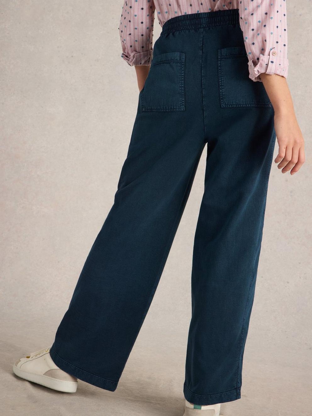 Ava Wide Leg Jersey Jogger  in MID DENIM - MODEL BACK