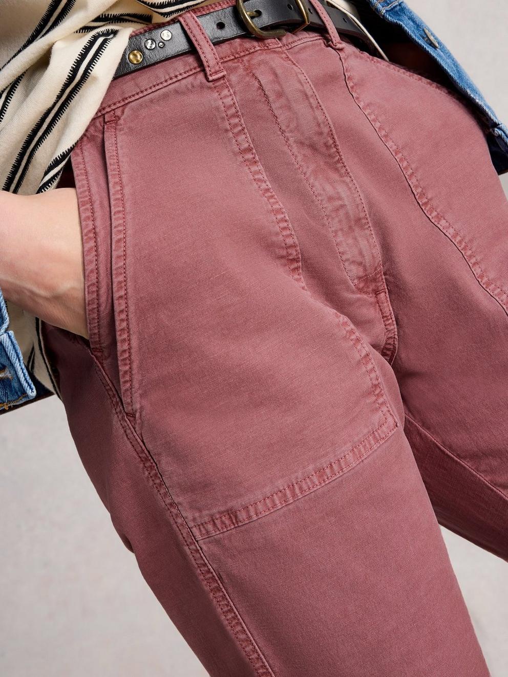 Twister Chino Trousers in MID PINK - MODEL DETAIL