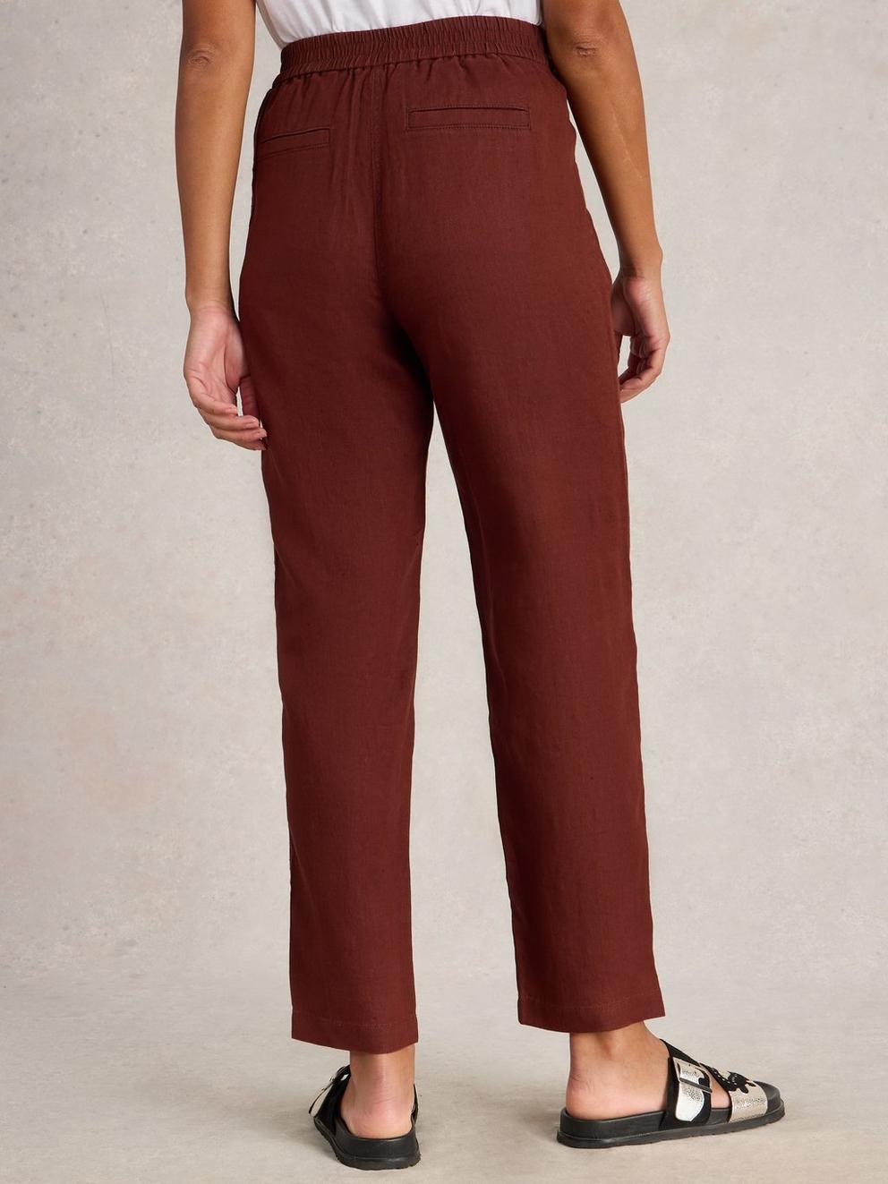 Rowena Linen Trousers in DK RED - MODEL BACK