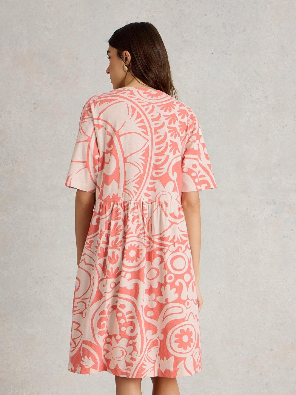Thea Short Sleeve Jersey Dress in CORAL MLT - MODEL BACK