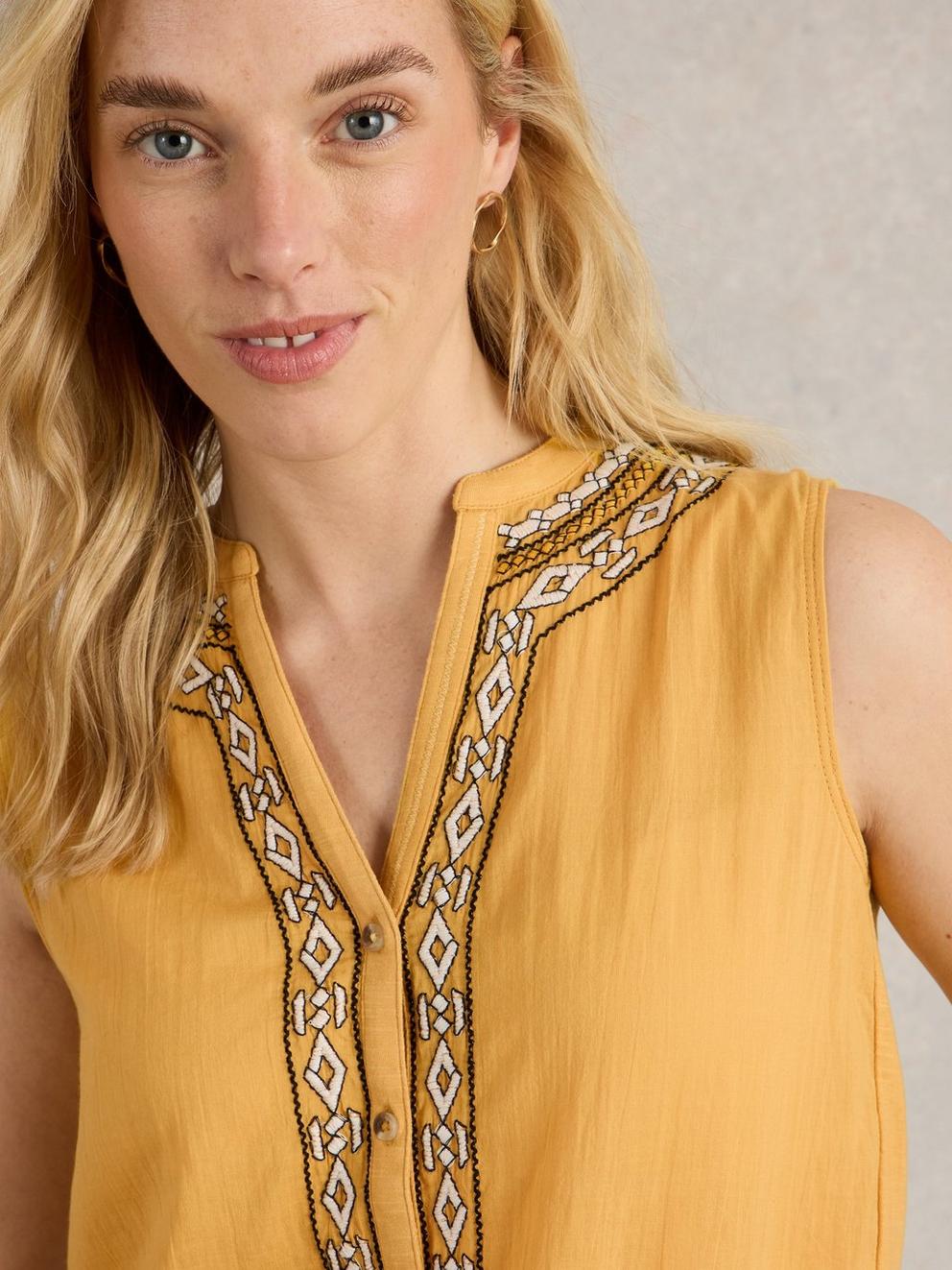 TULIP MIX SLEEVELESS SHIRT in MID YELLOW - MODEL DETAIL