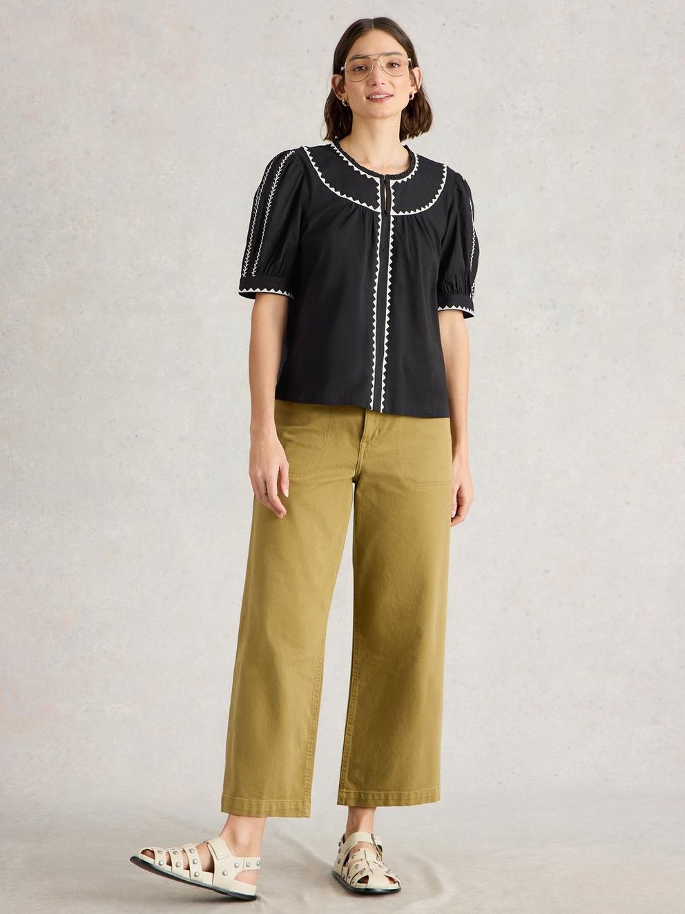 ZOE EMBROIDERED NOTCH NECK TOP in PURE BLK - MODEL FRONT