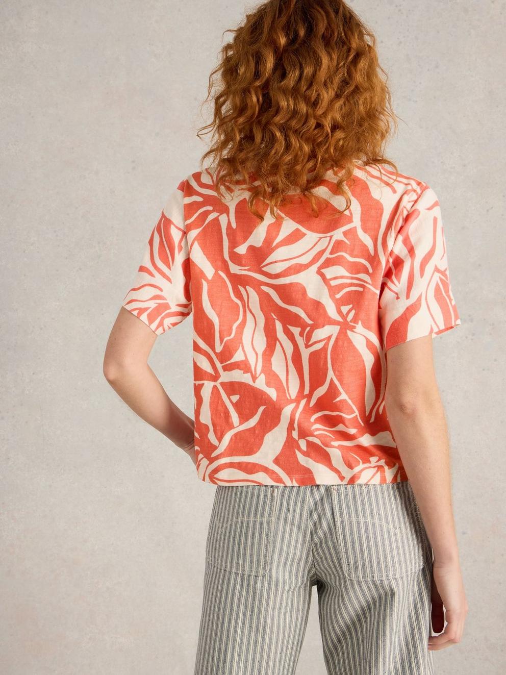 SARA CREW NECK TIE HEM TOP in CORAL PR - MODEL BACK