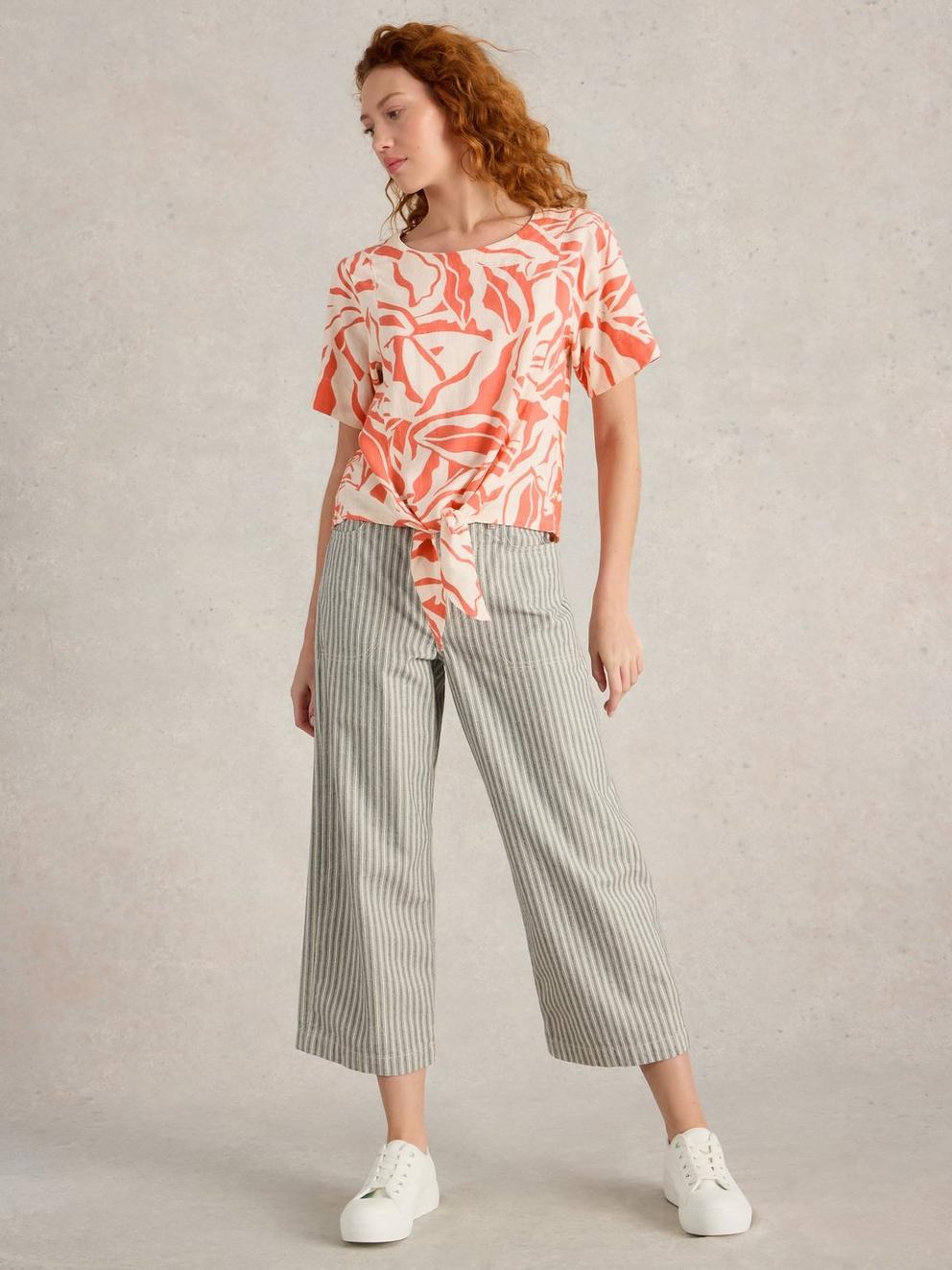 SARA CREW NECK TIE HEM TOP in CORAL PR - MODEL FRONT