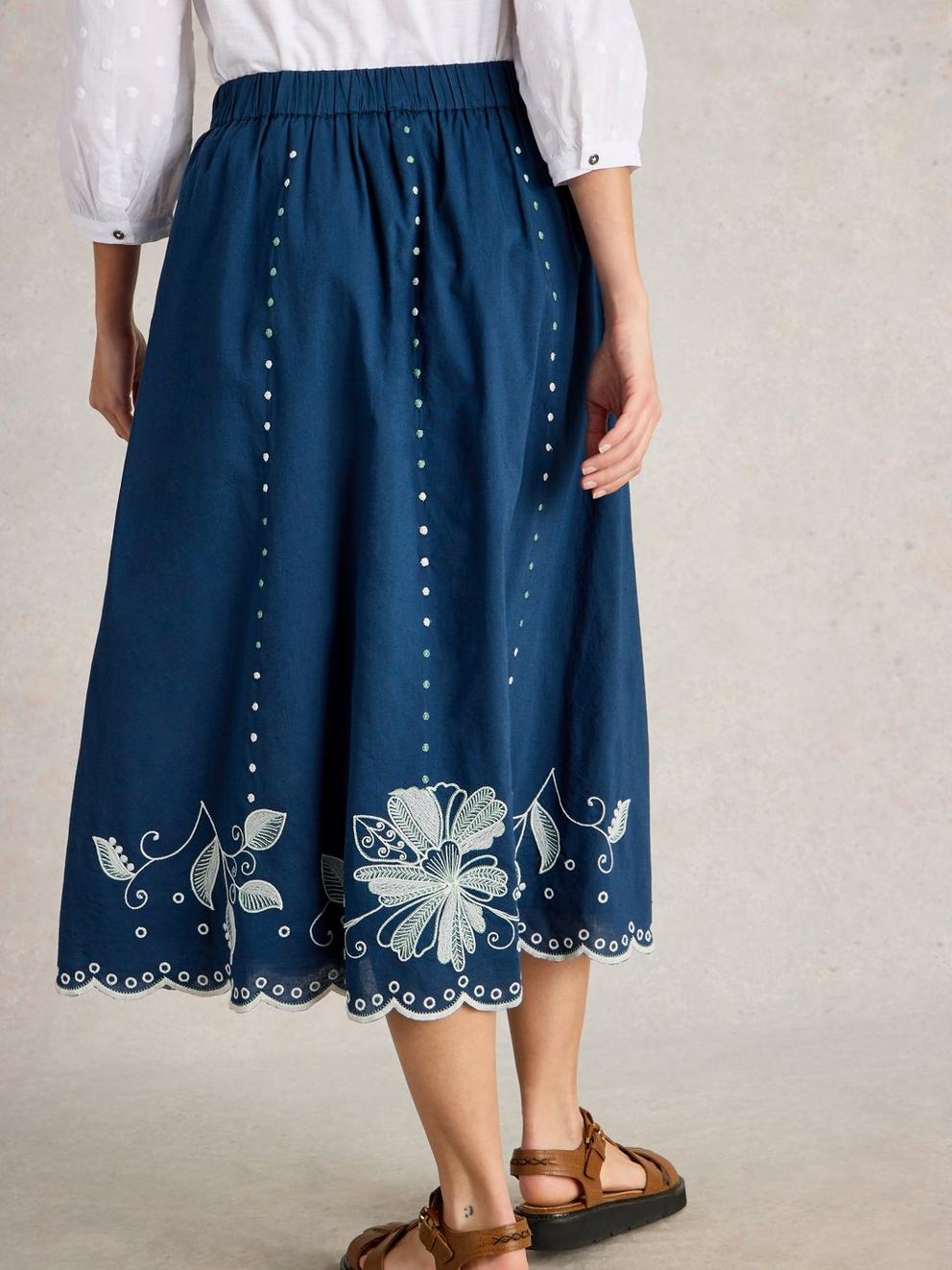 Calypso Embroidered Skirt in DK BLUE - MODEL BACK