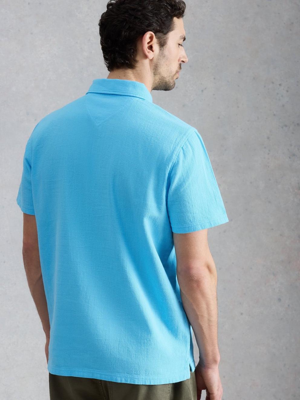 Anderby Woven Polo in MID BLUE - MODEL BACK