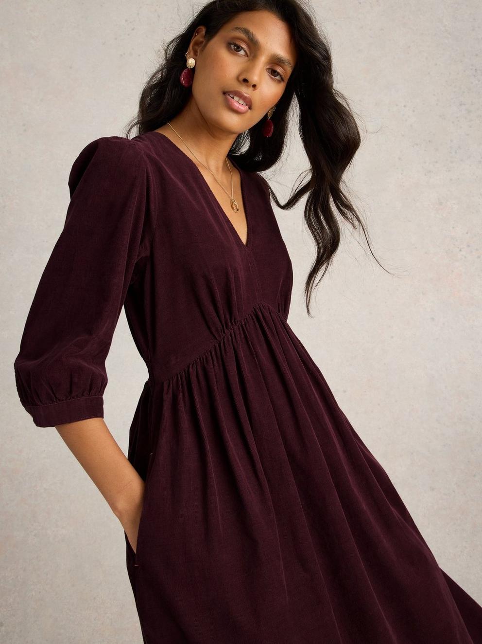 Lucy V Neck Cord Midi Dress in DK PLUM - MODEL DETAIL