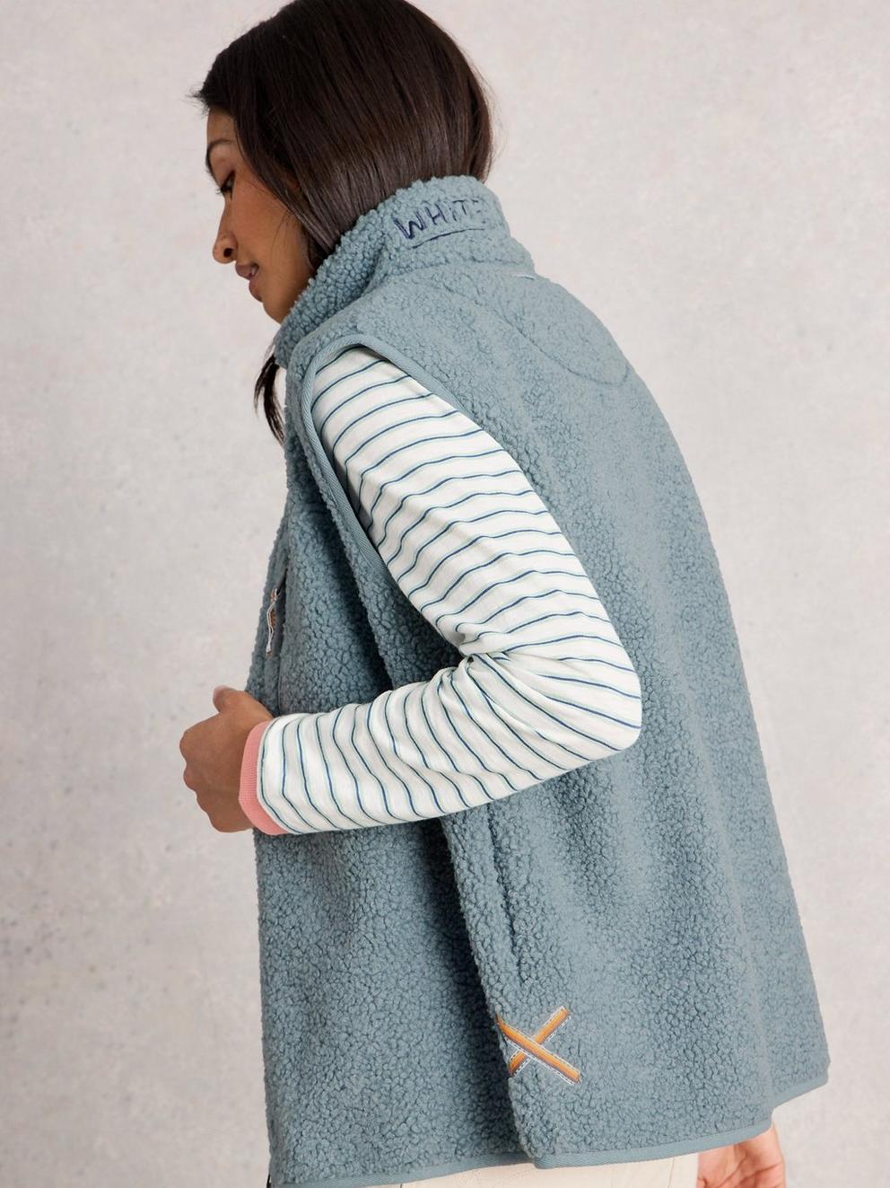 BORG ZIP THROUGH GILET in DUS BLUE - MODEL BACK