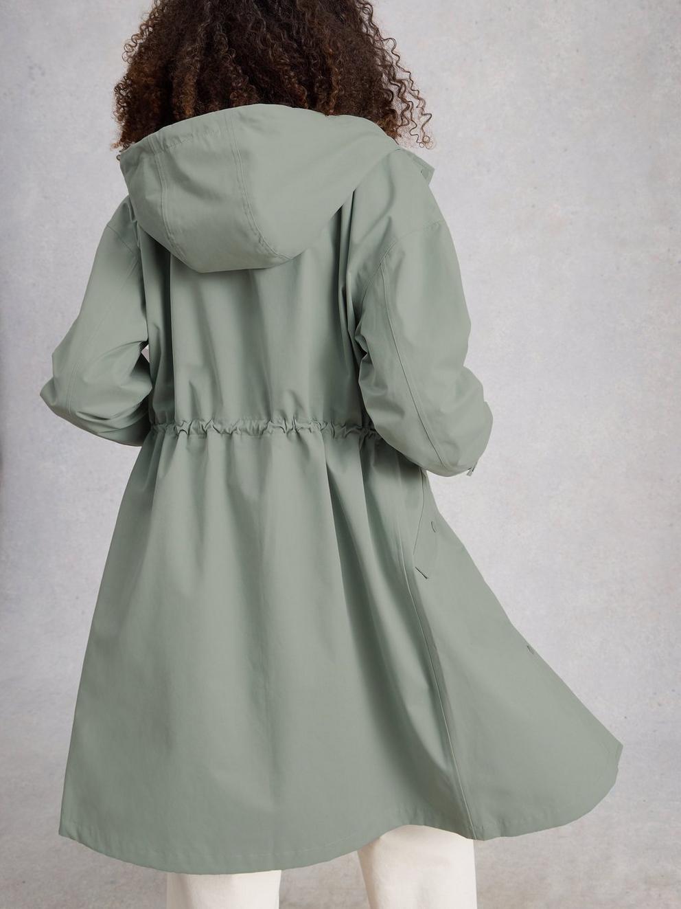 Beth Waterproof Coat in MID GREEN - MODEL BACK