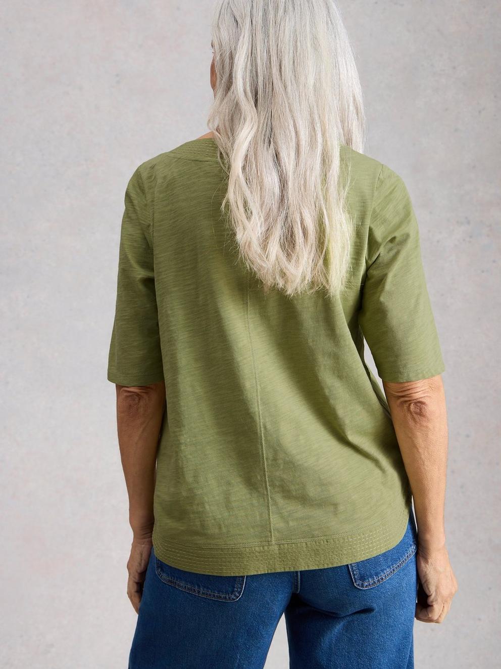 WEAVER BRODERIE TEE in KHAKI GRN - MODEL BACK