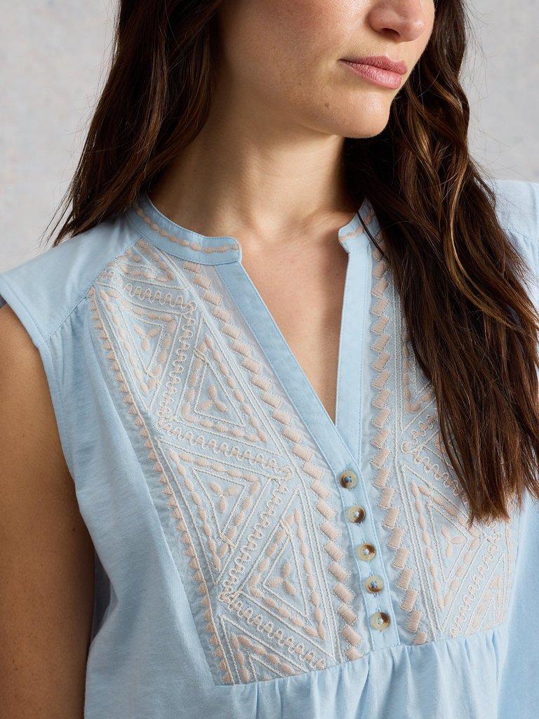 PEONY SLEEVELESS COLLARED SHIRT in MID BLUE - MODEL DETAIL