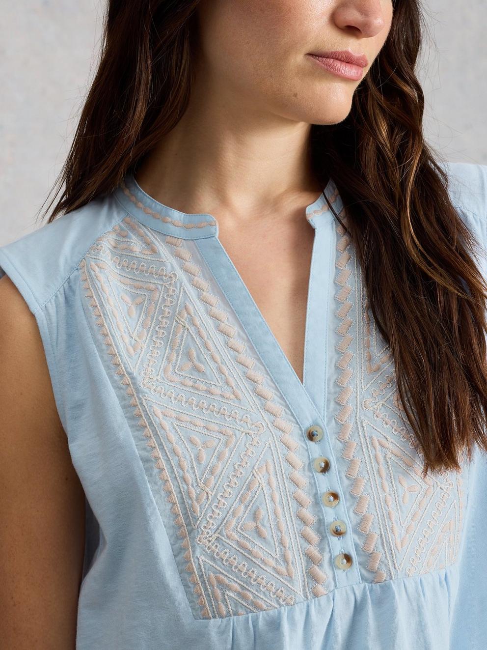 PEONY SLEEVELESS COLLARED SHIRT in MID BLUE - MODEL DETAIL