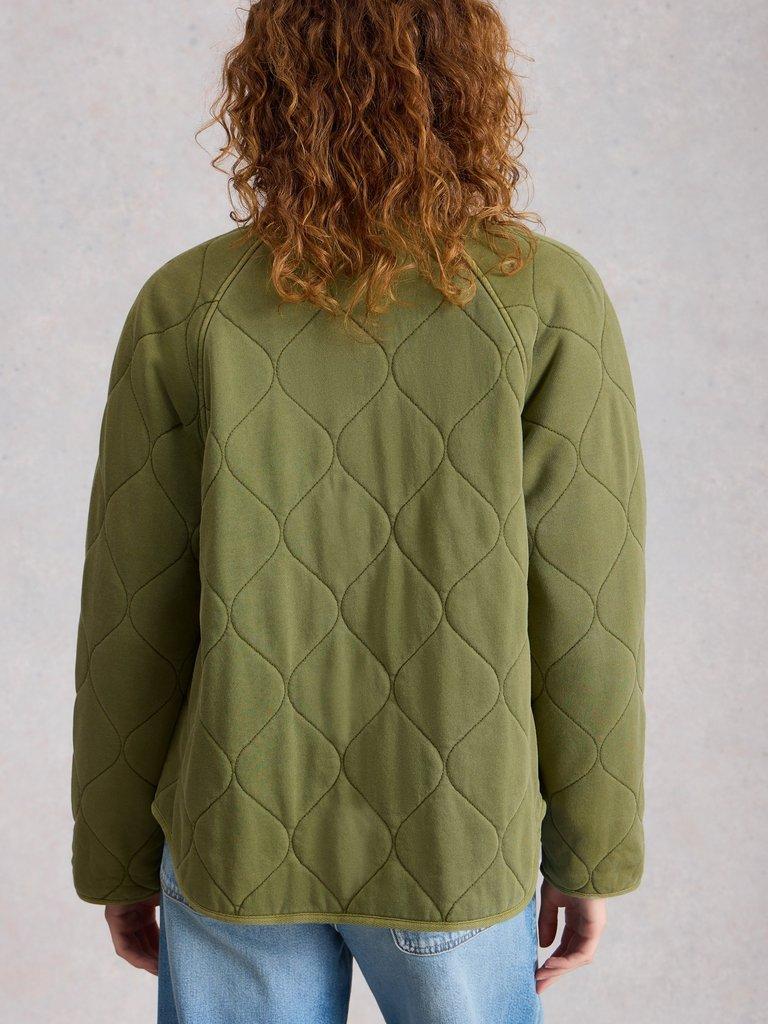 Anya Jersey Quilted Jacket in MID GREEN - MODEL BACK