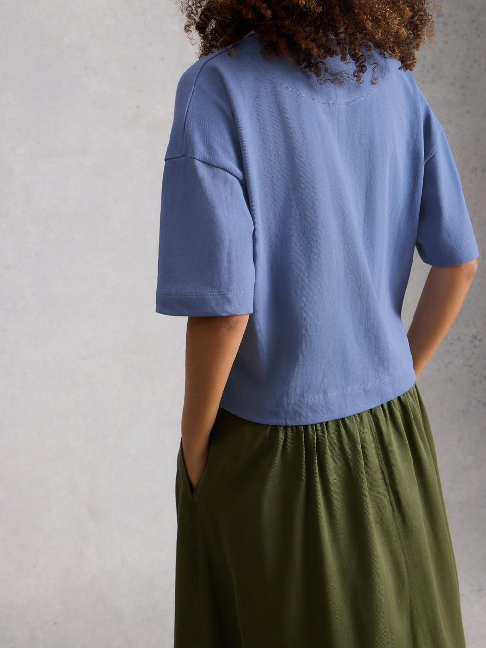 RUBY RUGBY TOP in MID BLUE - MODEL BACK