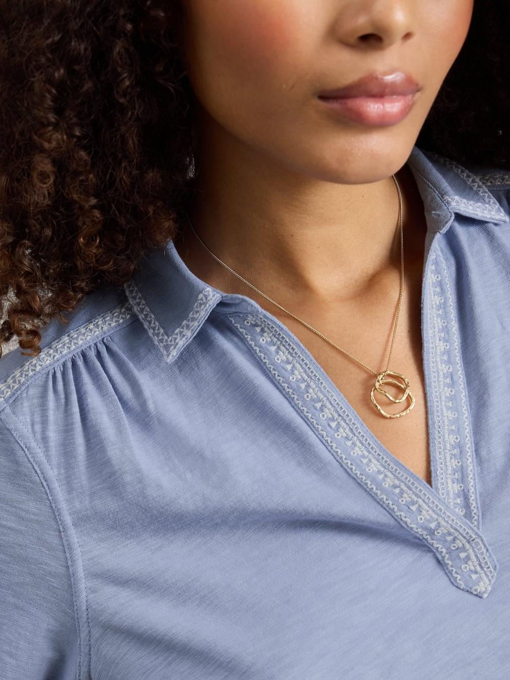 ALLIE EMBROIDERED SS SHIRT in MID BLUE - MODEL DETAIL