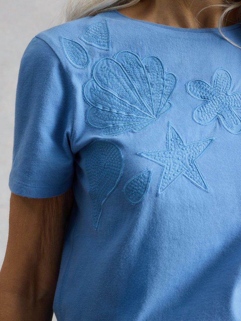 ABBIE EMBROIDERED T-SHIRT in MID BLUE - MODEL DETAIL