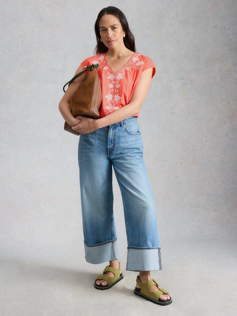 FLISS FLORAL V NECK TOP in CORAL MLT - MODEL FRONT