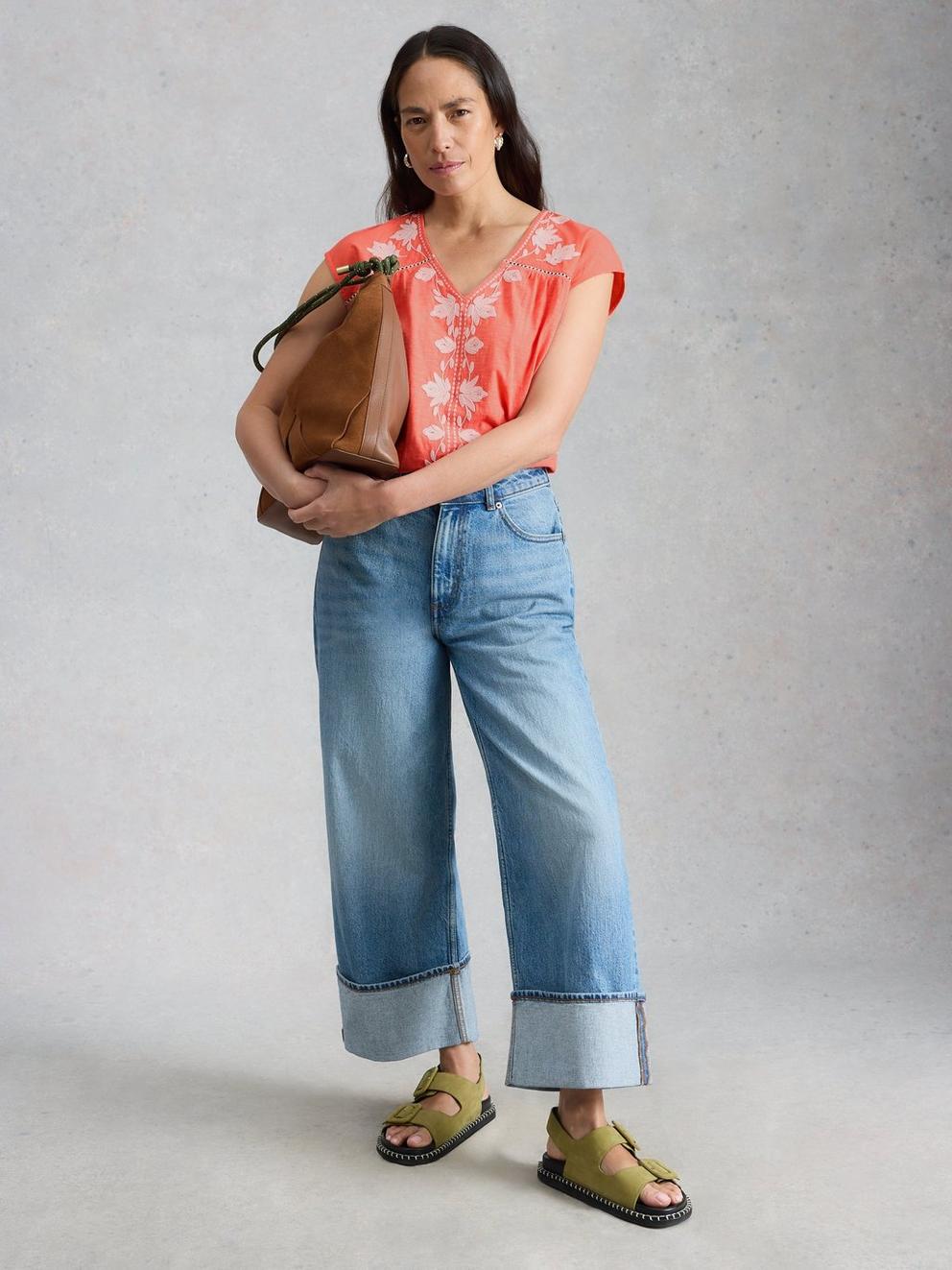 FLISS FLORAL V NECK TOP in CORAL MLT - MODEL FRONT