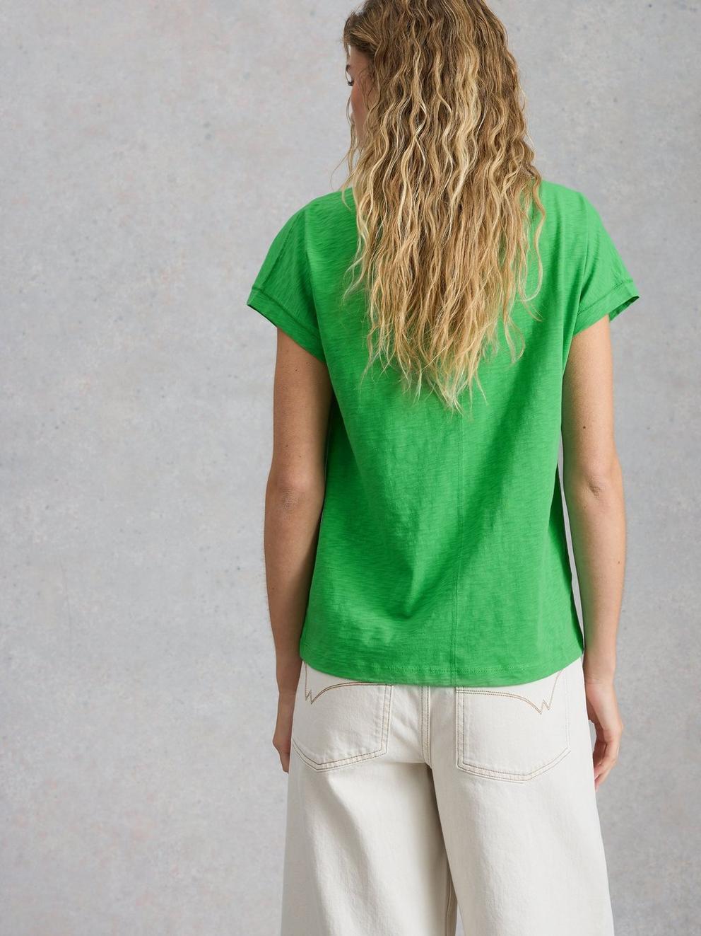 NELLY NOTCH V NECK TEE in BRT GREEN - MODEL BACK