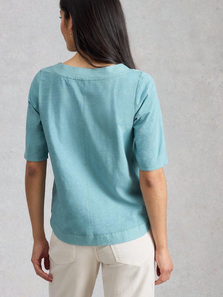 WEAVER BRODERIE NOTCH NECK TEE in TEAL MLT - MODEL BACK