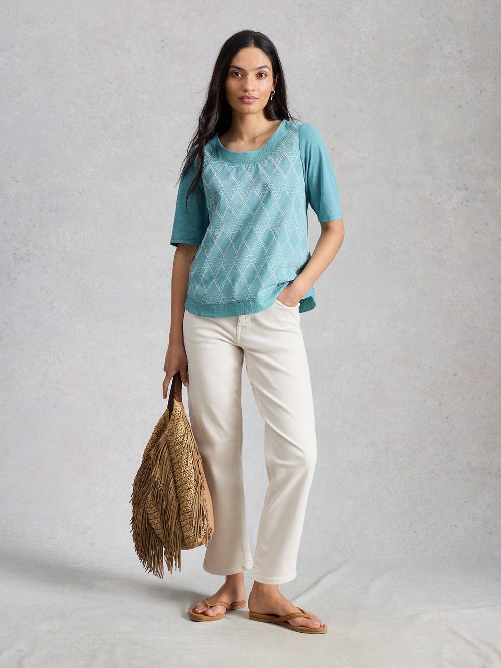 WEAVER BRODERIE NOTCH NECK TEE in TEAL MLT - MODEL FRONT