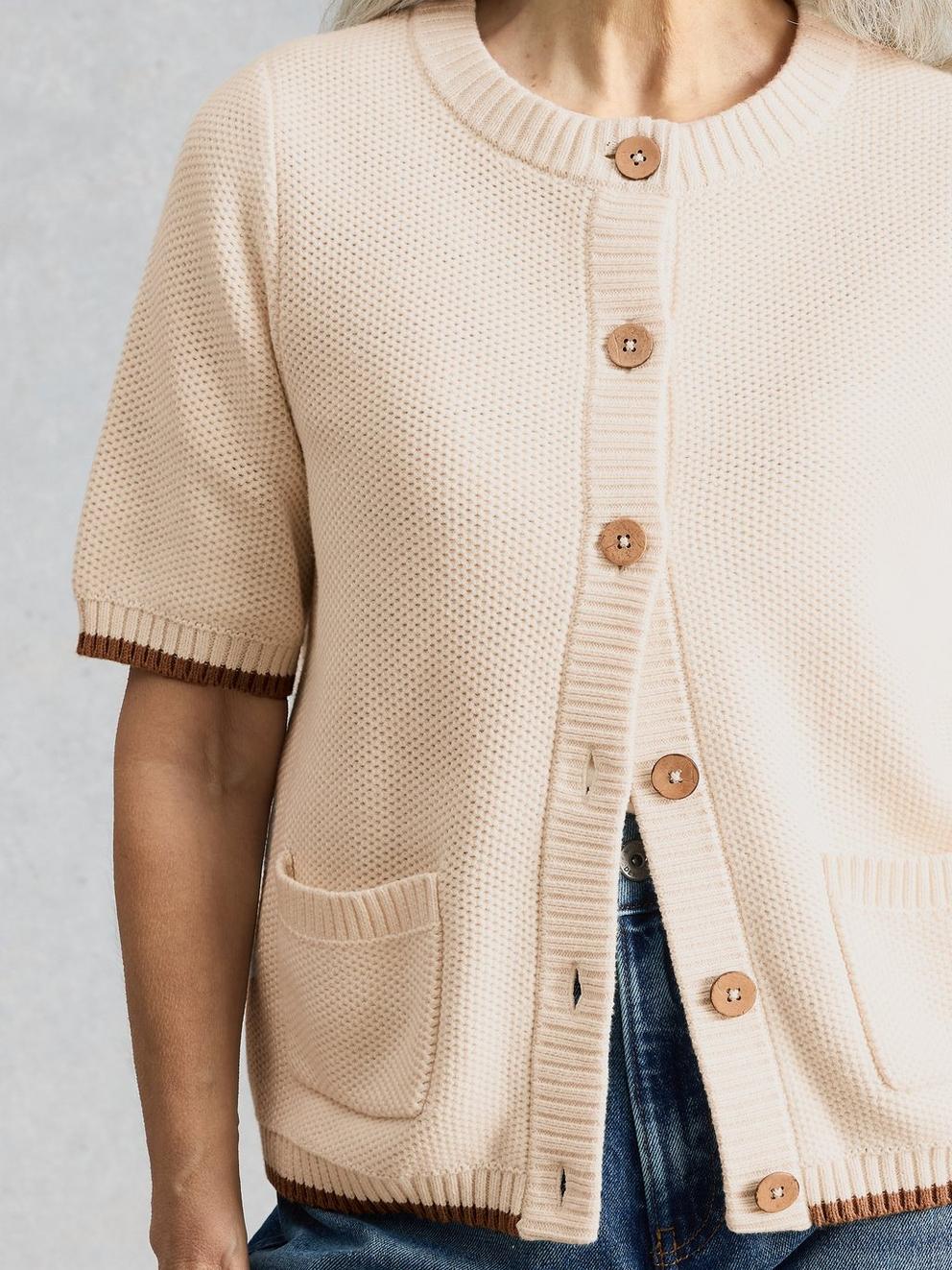 ISABELLA SHORT SLEEVE CARDIGAN in PALE IVORY - MODEL DETAIL
