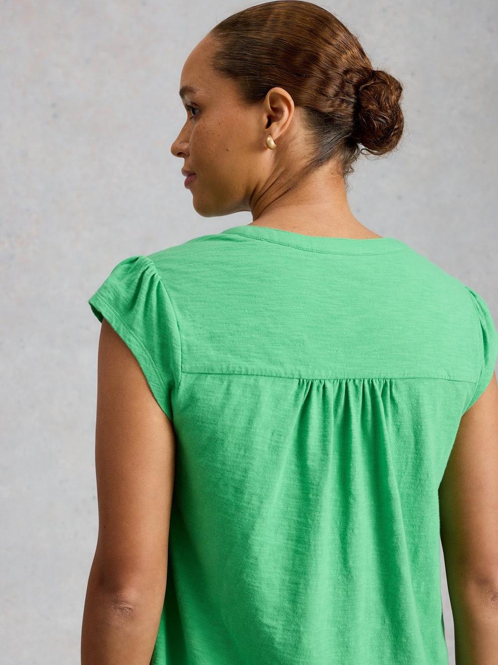 AMELIA EMBROIDERY TOP in BRT GREEN - MODEL BACK
