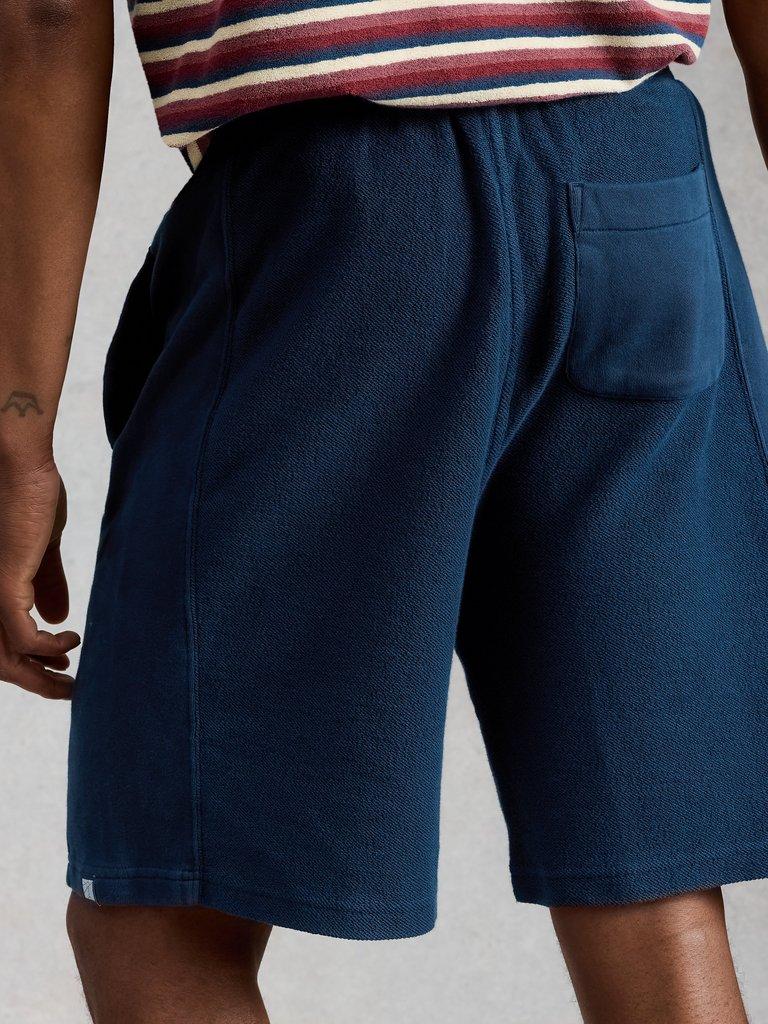 Sidmouth Sweat Short in DARK NAVY - MODEL BACK