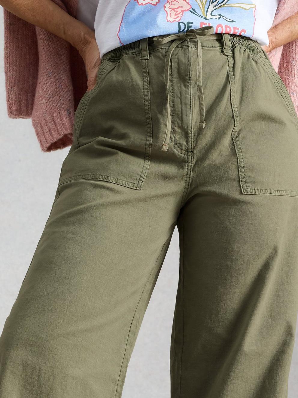 Storm Wide Leg Chino Trouser in DUS GREEN - MODEL DETAIL