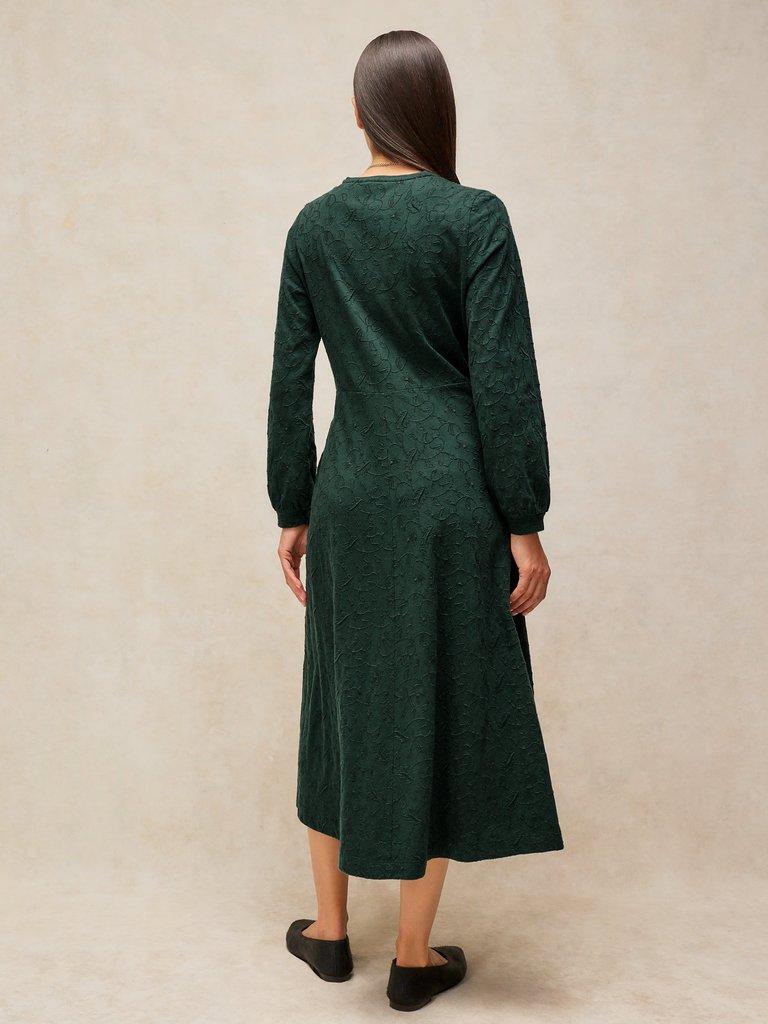 MEGAN EMBROIDERED JERSEY DRESS in DK GREEN - MODEL BACK
